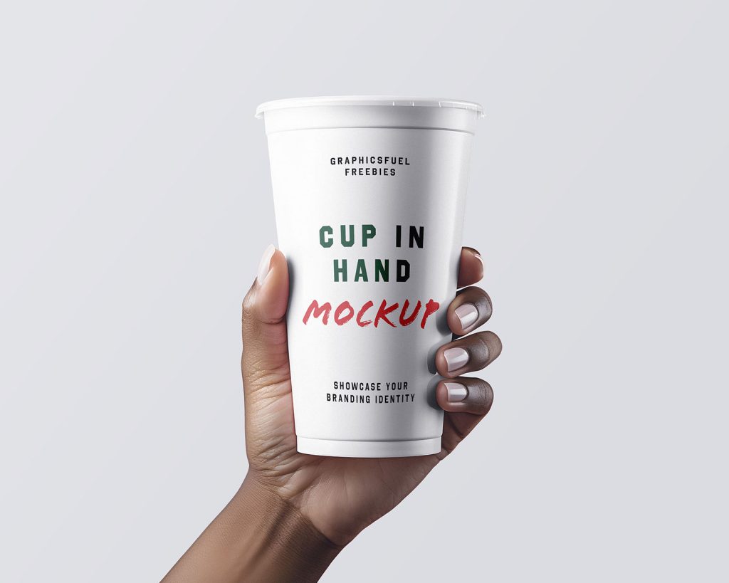 Coffee cup in hand mockup