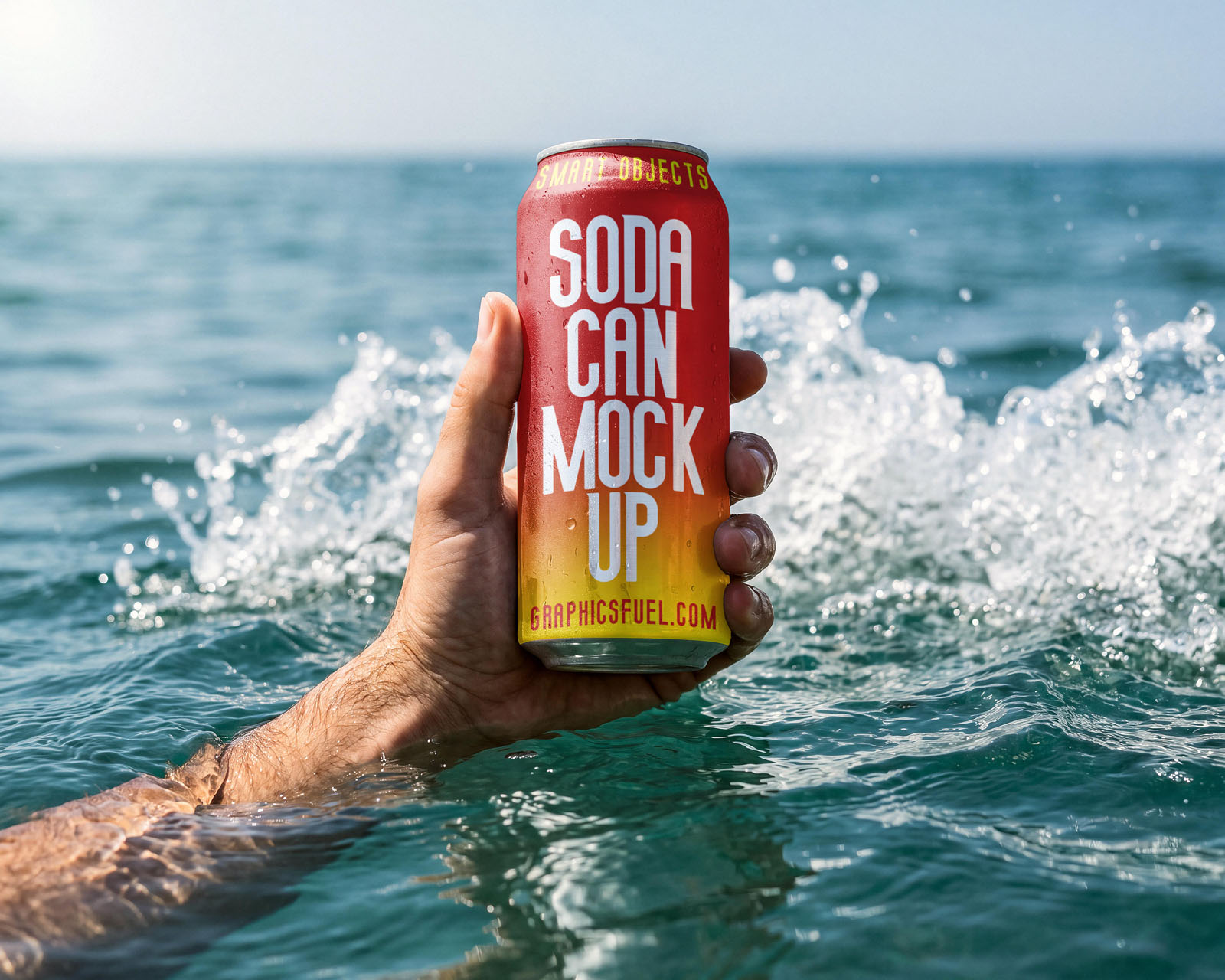Hand raising a soda can mockup out of a breaking ocean wave