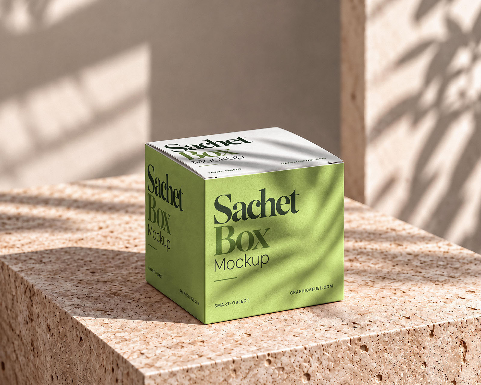 Sachet box mockup showing a closed packaging box on a textured stone surface in natural light.